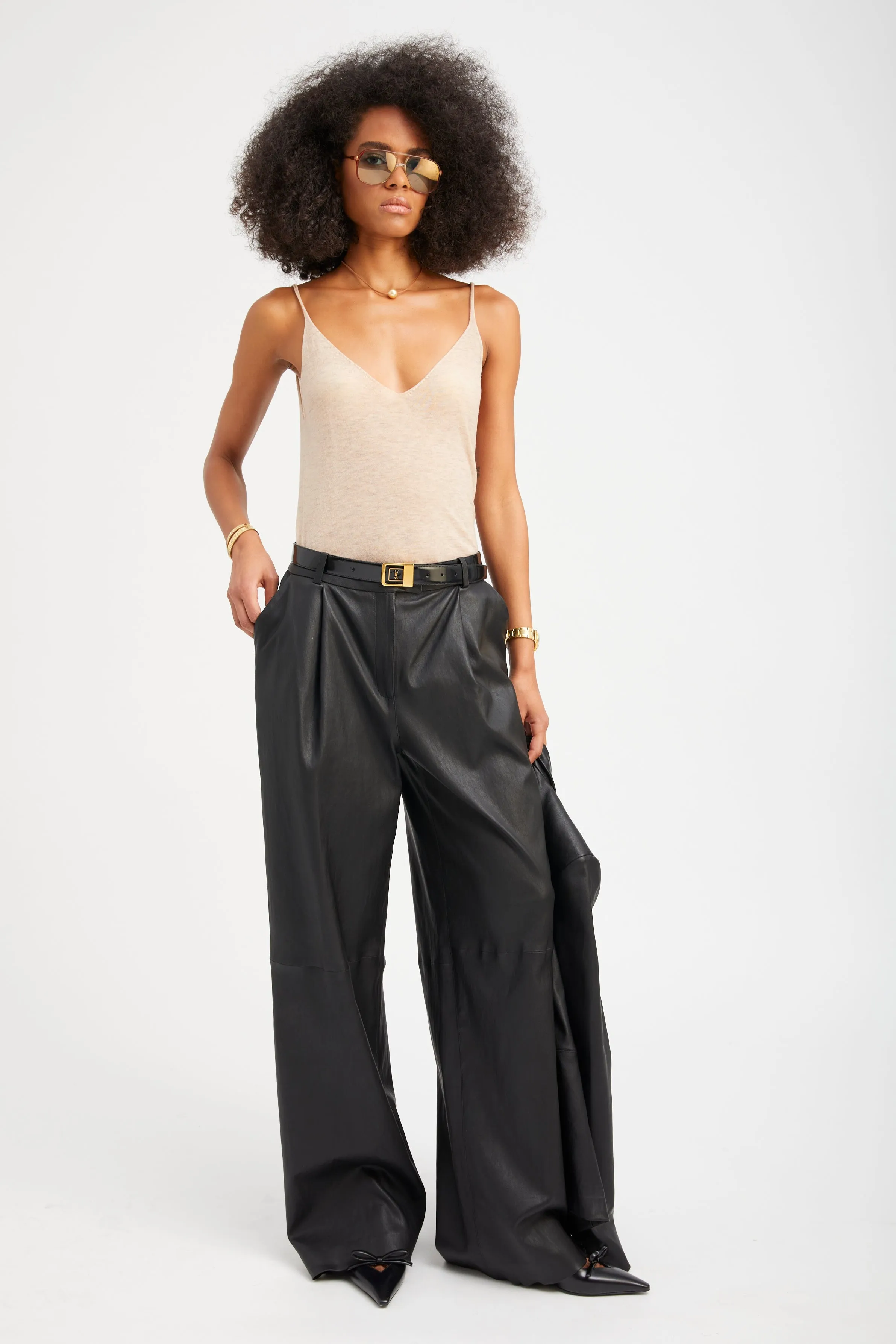 Black Leather Paloma Pleated Trousers sold by SPRWMN