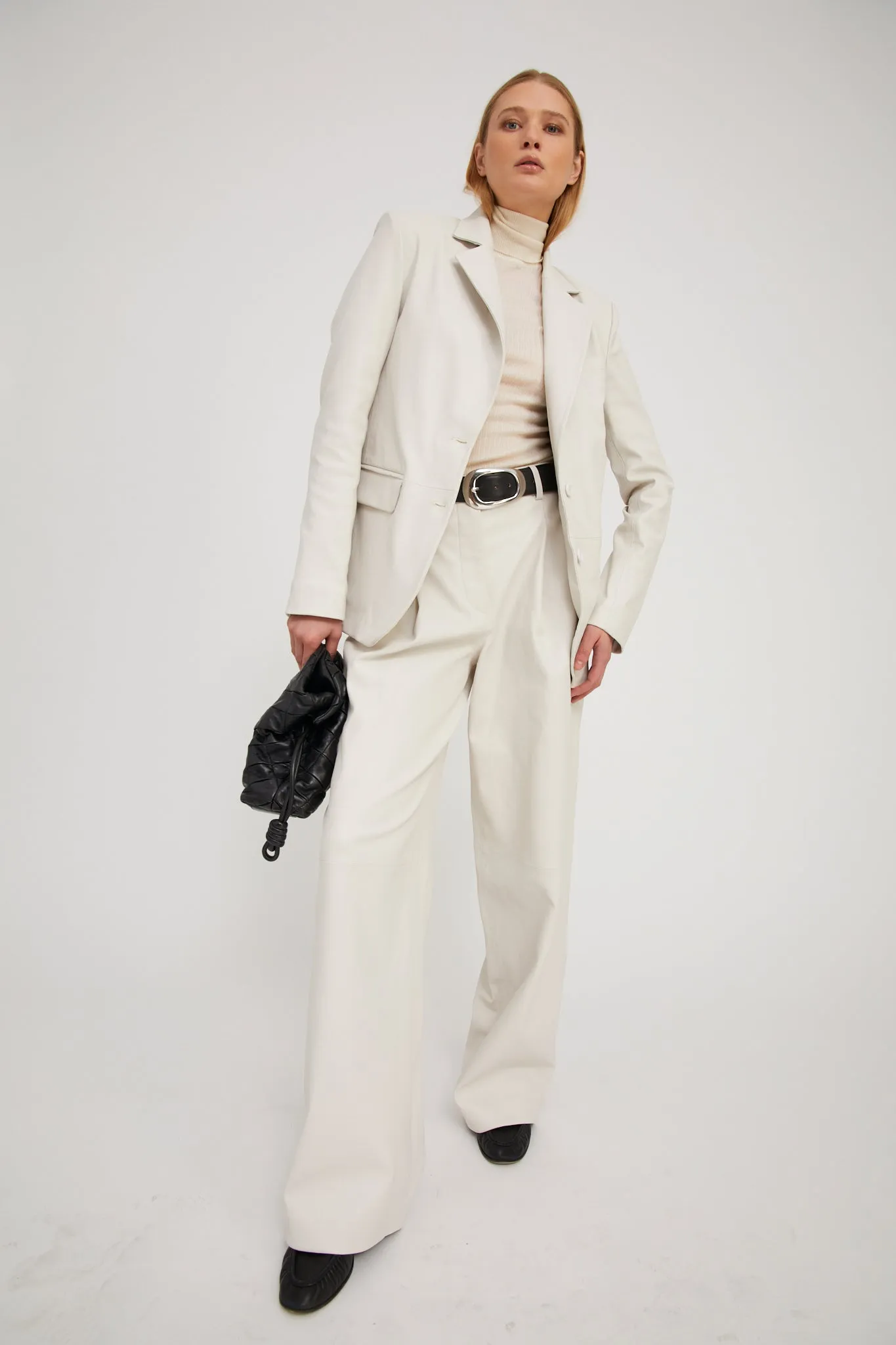 Leather Paloma Pleated Trousers sold by SPRWMN