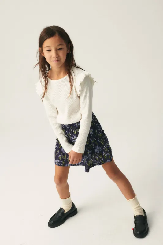 Top de niña en punto canalé blanco sold by Compania Fantasica