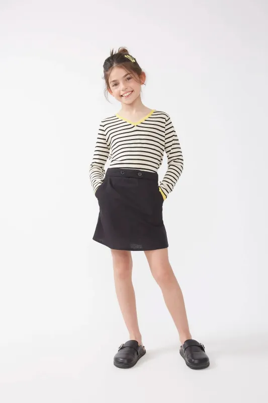 Falda corta de niña botones negro sold by Compania Fantasica