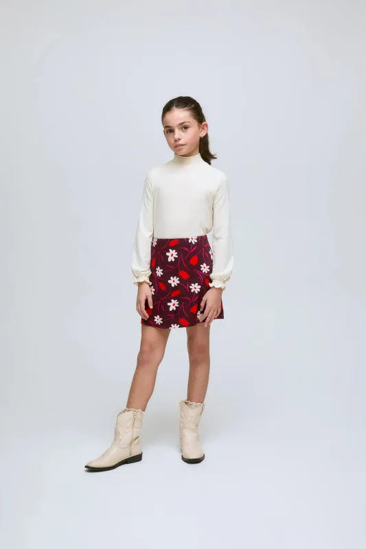 Falda corta de niña con estampado floral Tulip y cintura elástica. sold by Compania Fantasica