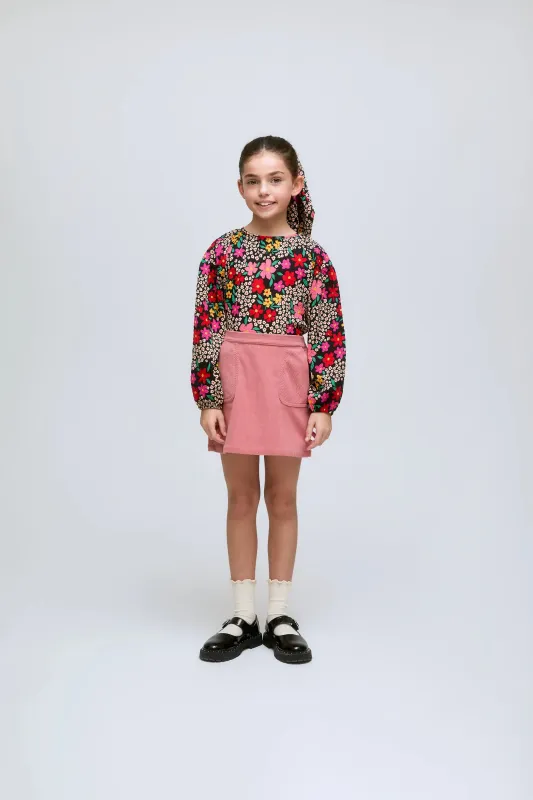 Falda corta de pana rosa con bolsillos delanteros sold by Compania Fantasica