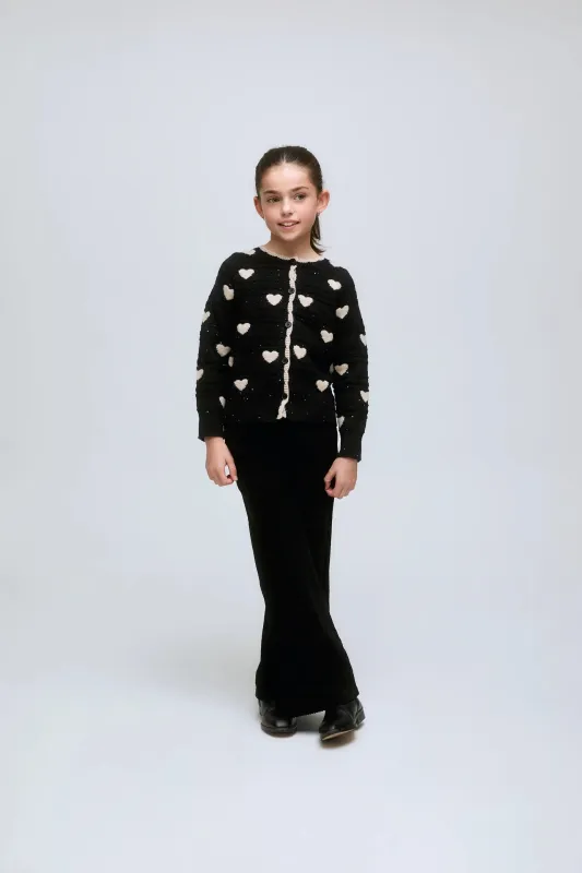 Cárdigan de niña negro con corazones blancos y botones frontales. sold by Compania Fantasica