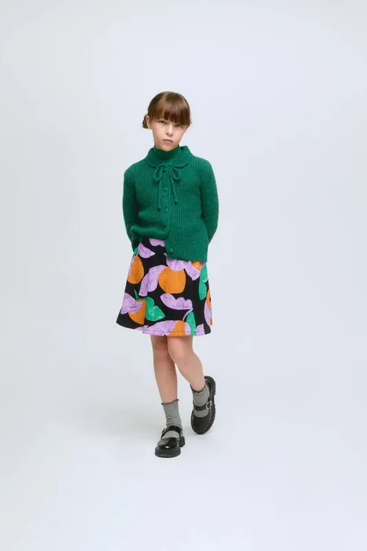 Falda corta de niña con estampado de frutas Apricot sold by Compania Fantasica