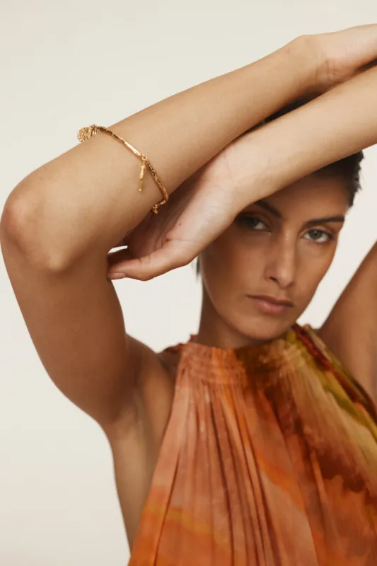 REVERIE SEA SHELL CHARM BANGLE sold by Alemais