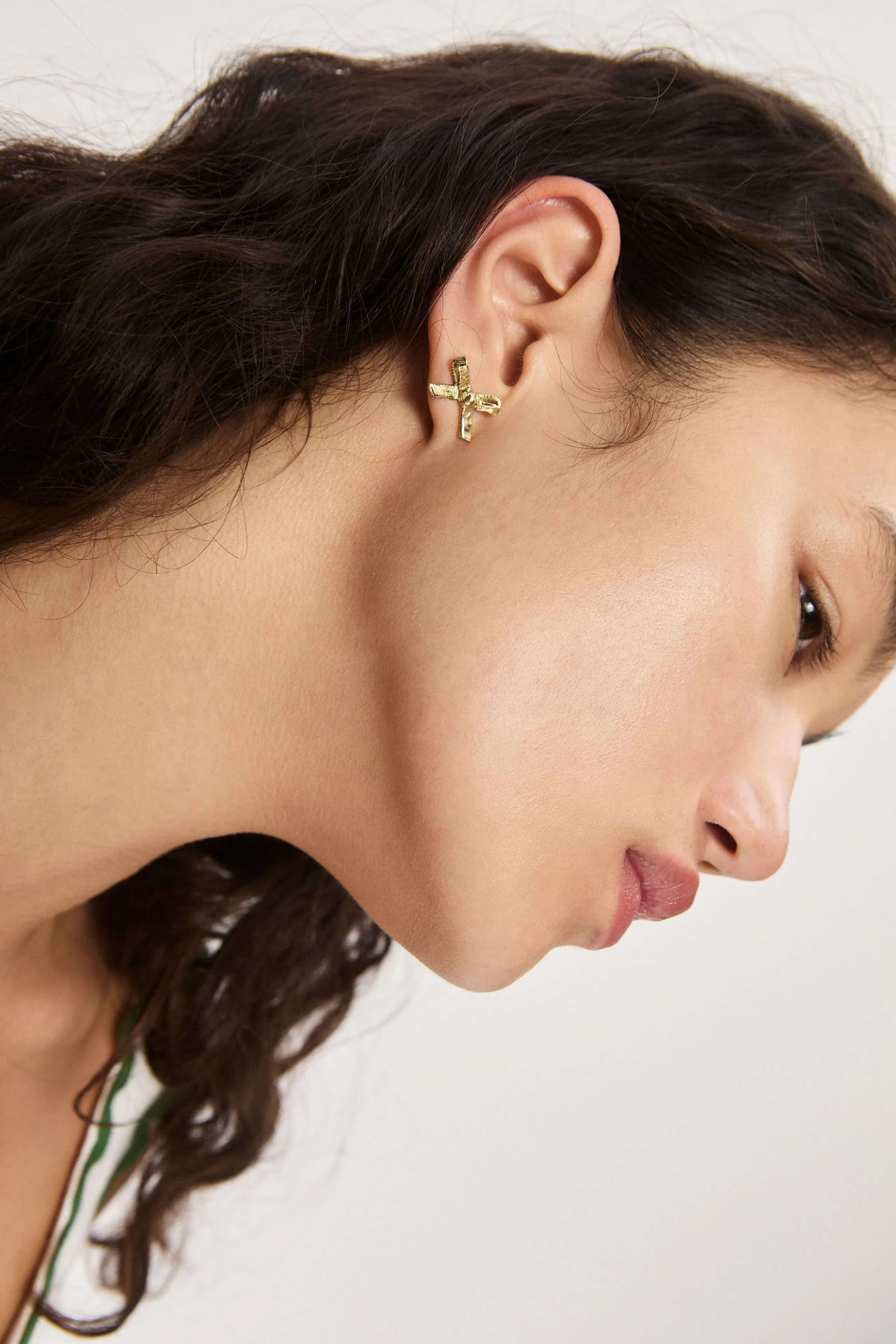 TEAM SPIRIT BOW STUDS sold by Alemais