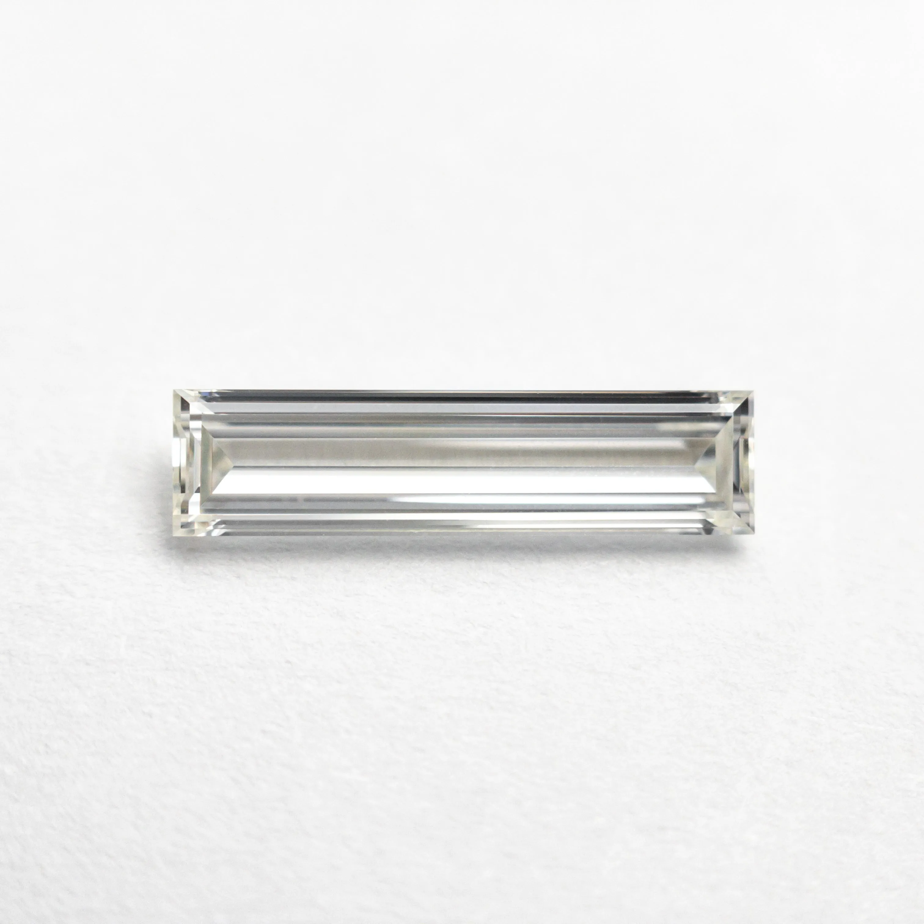 0.70ct 11.58x2.89x1.80mm GIA Internally Flawless H Baguette Step Cut 24300-01 sold by Young In The Mountains