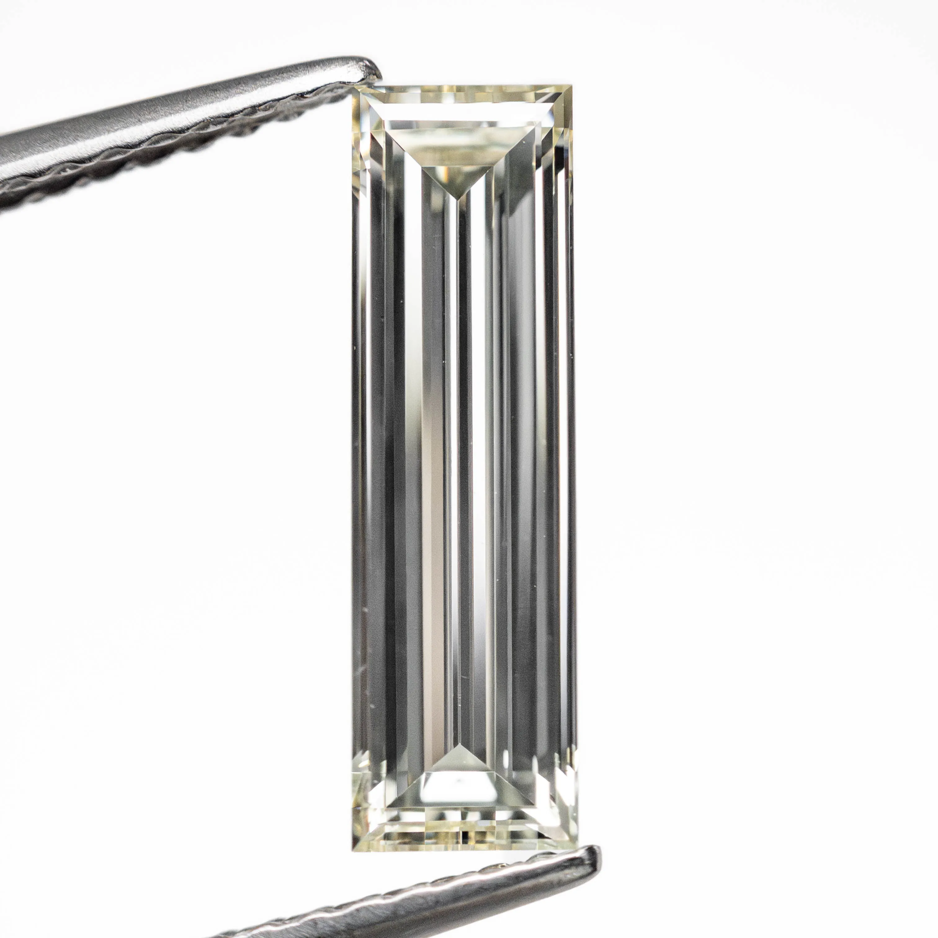 1.31ct 13.12x3.81x2.38mm VS1 L-M Baguette Step Cut 24700-01 sold by Young In The Mountains product image thumbnail 2