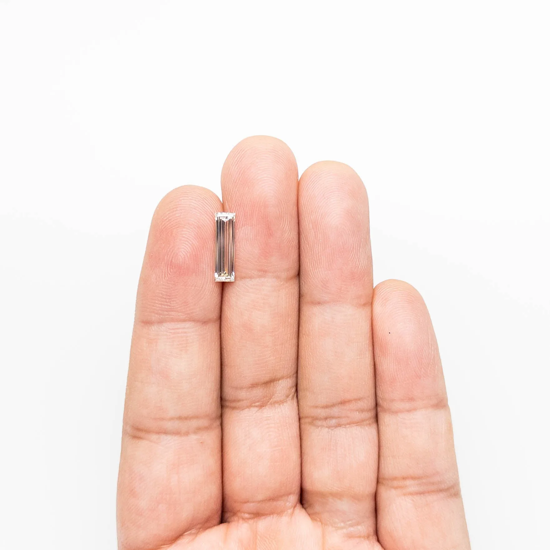 1.31ct 13.12x3.81x2.38mm VS1 L-M Baguette Step Cut 24700-01 sold by Young In The Mountains product image thumbnail 3