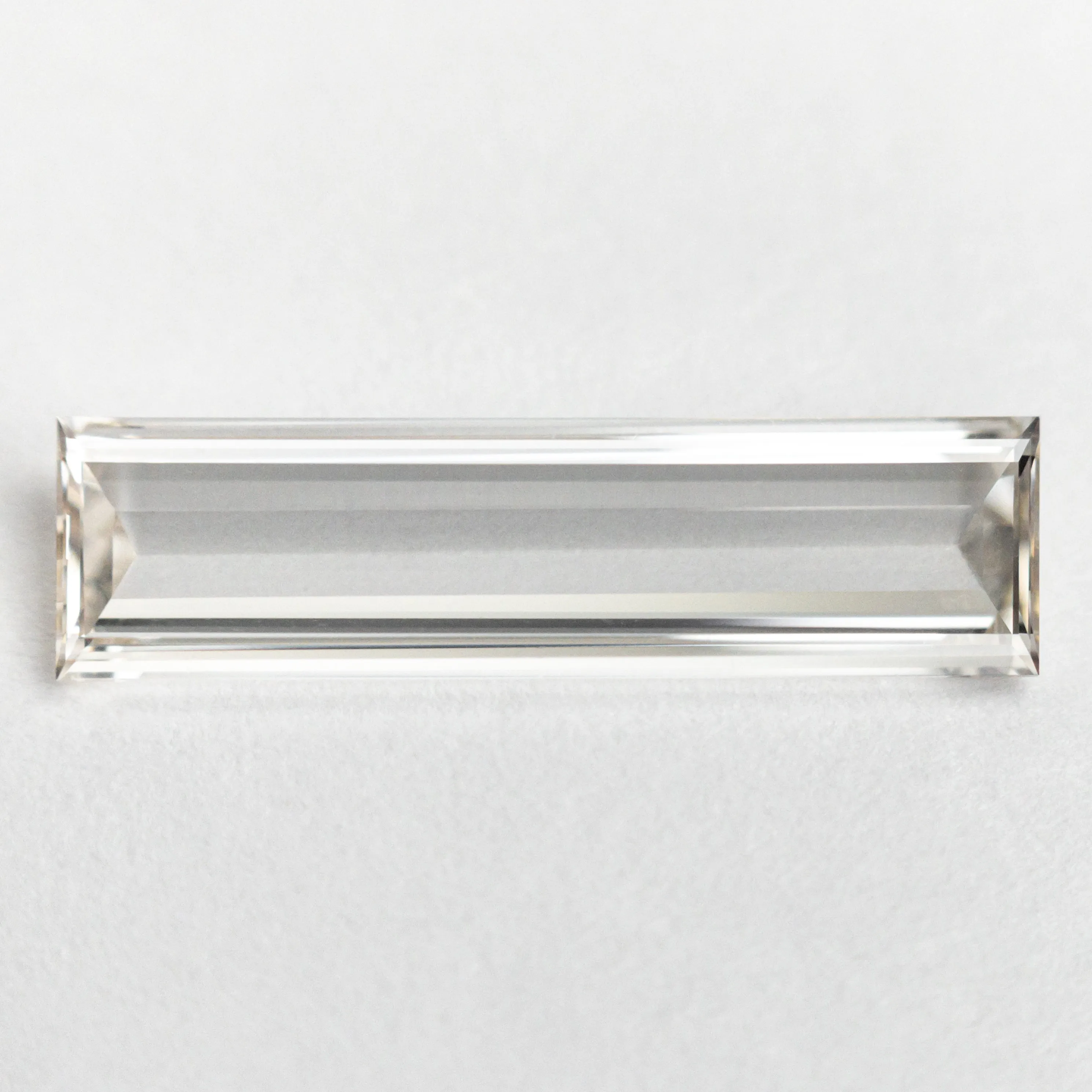 1.10ct 15.57x4.14x1.48mm GIA VS1 J Baguette Step Cut 24305-01 sold by Young In The Mountains