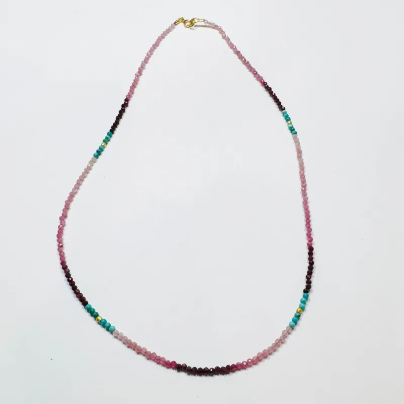 delicate shaded ruby necklace with turquoise and gold nuggets sold by Theodosia