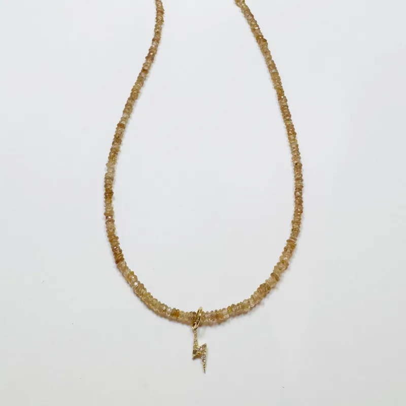 neutral zircon with diamond lightening bolt sold by Theodosia