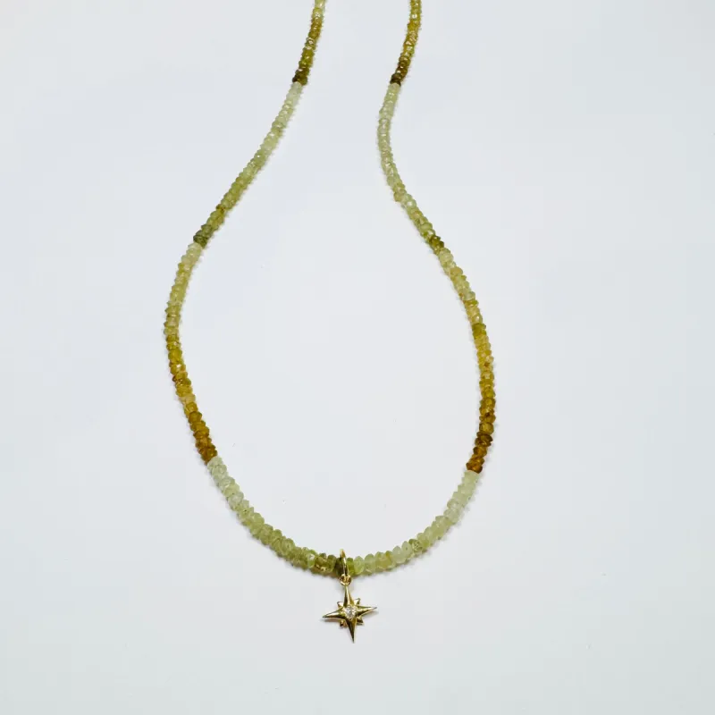 grossular garnet with diamond and gold starburst sold by Theodosia