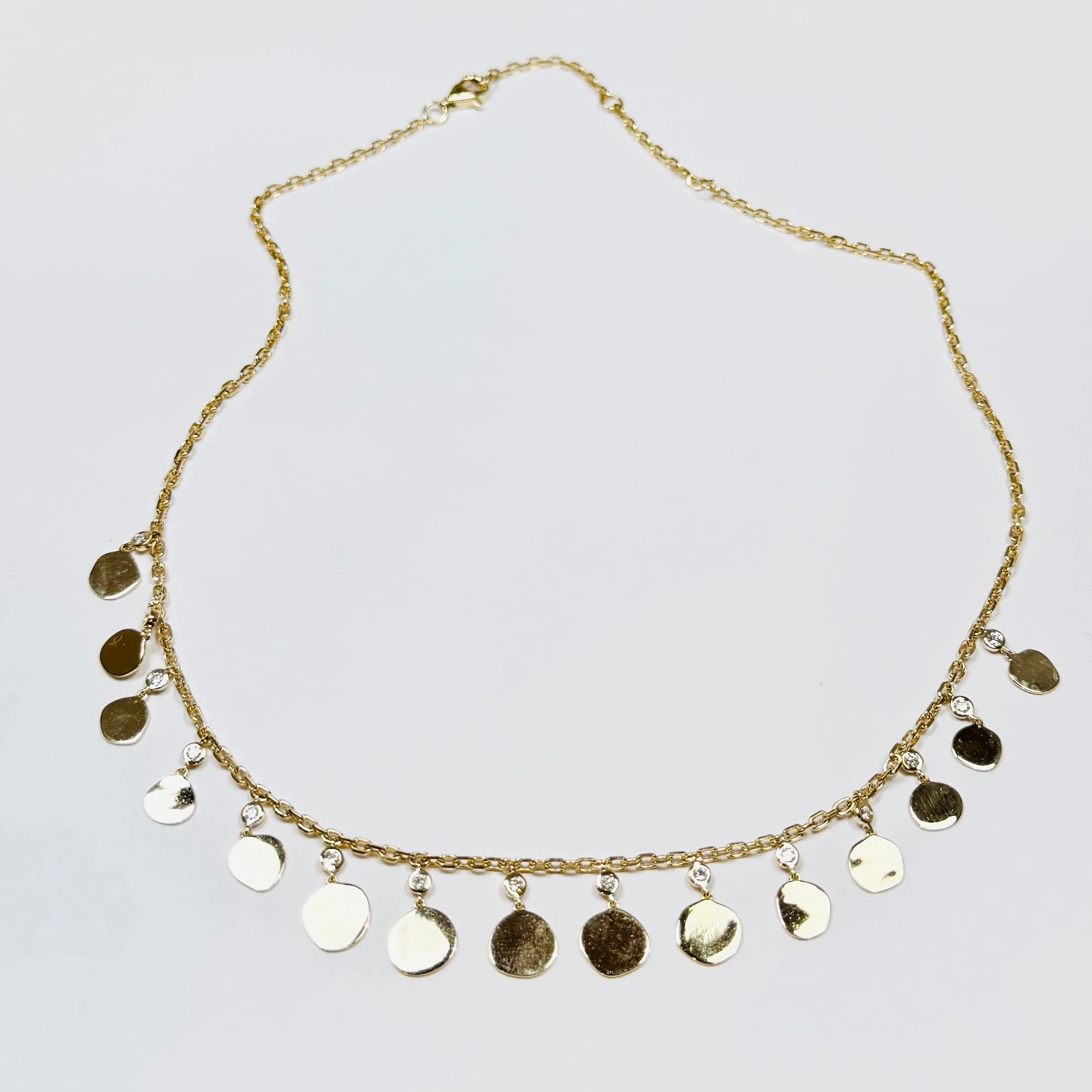organic disc fringe necklace sold by Theodosia