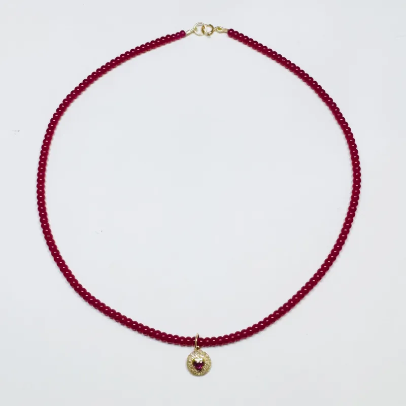 delicate smooth ruby necklace with dome heart charm sold by Theodosia