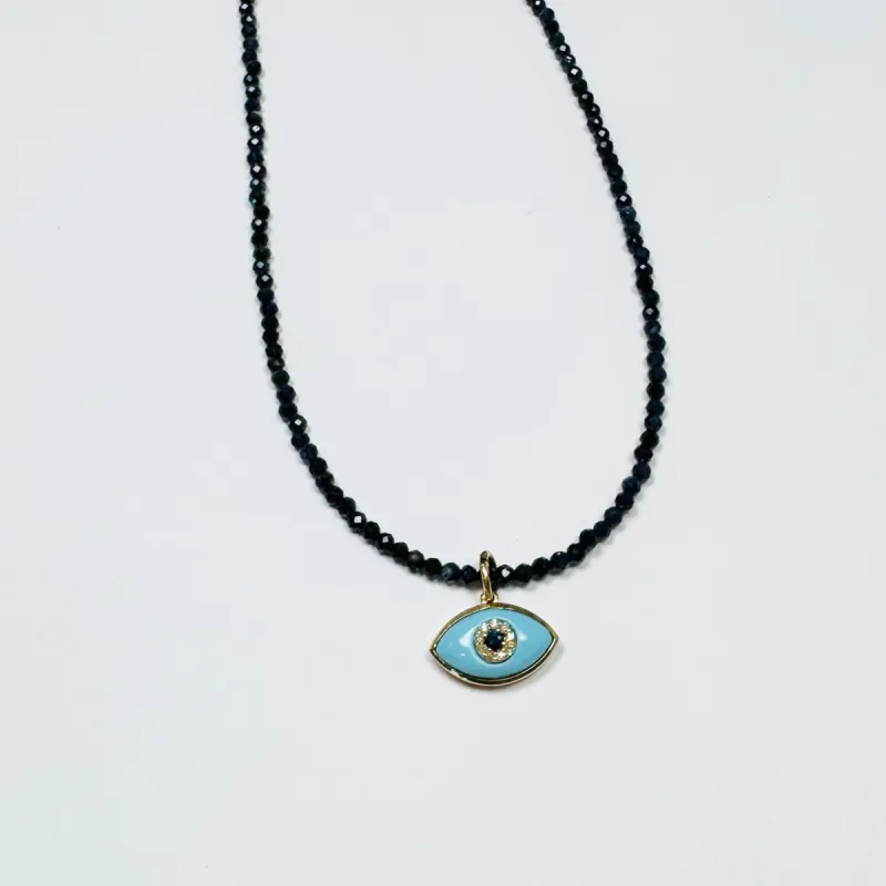 delicate lapis necklace with evil eye charm sold by Theodosia