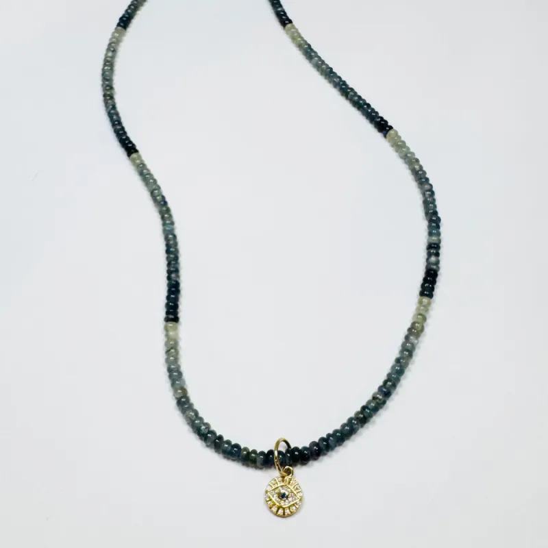 shaded blue sapphire with evil eye medallion sold by Theodosia