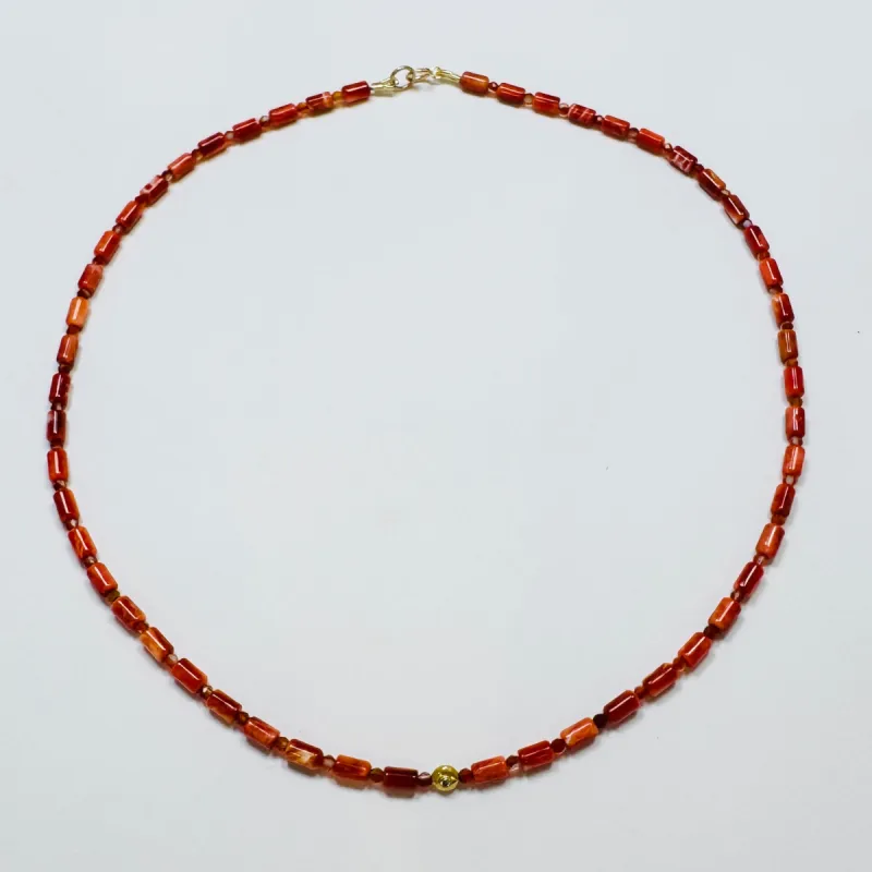 coral tube necklace with diamond star bead sold by Theodosia