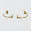 double bezel set diamond studs with chain sold by Theodosia