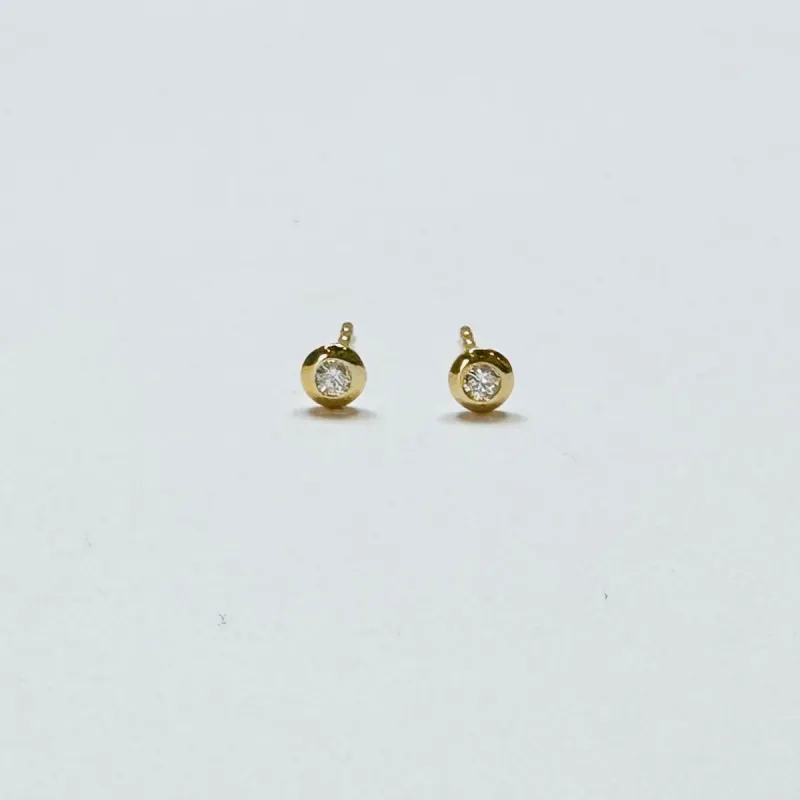 flat bezel diamond studs sold by Theodosia