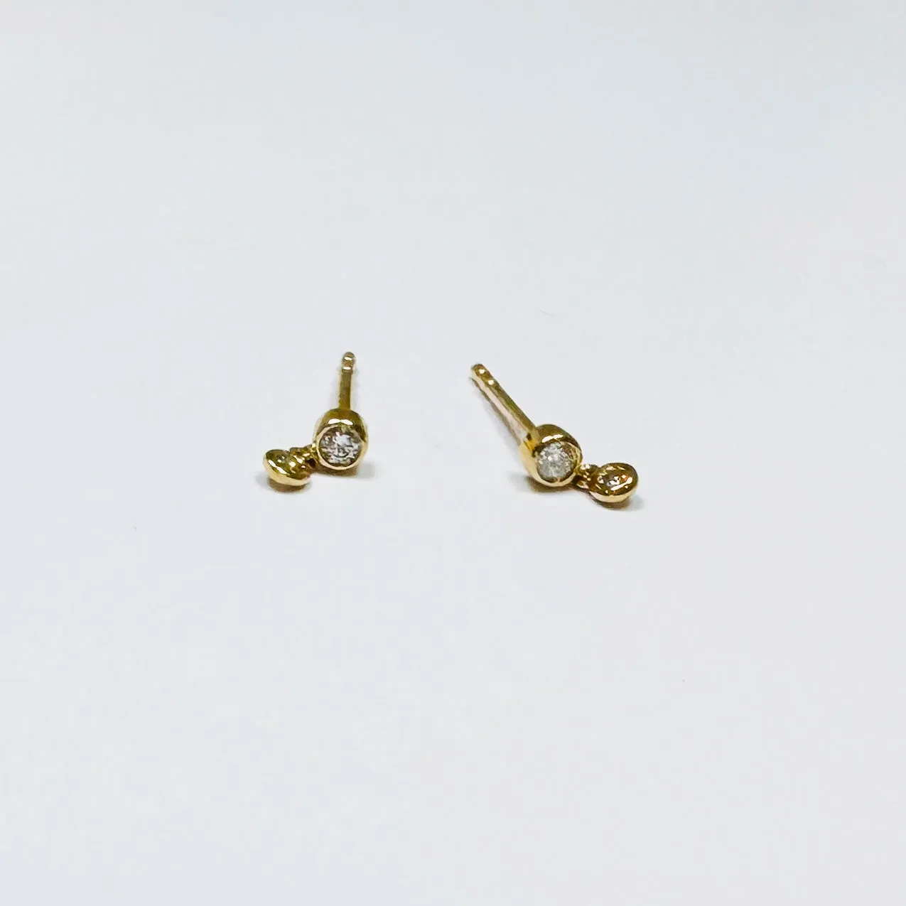 bezel diamond charm studs sold by Theodosia