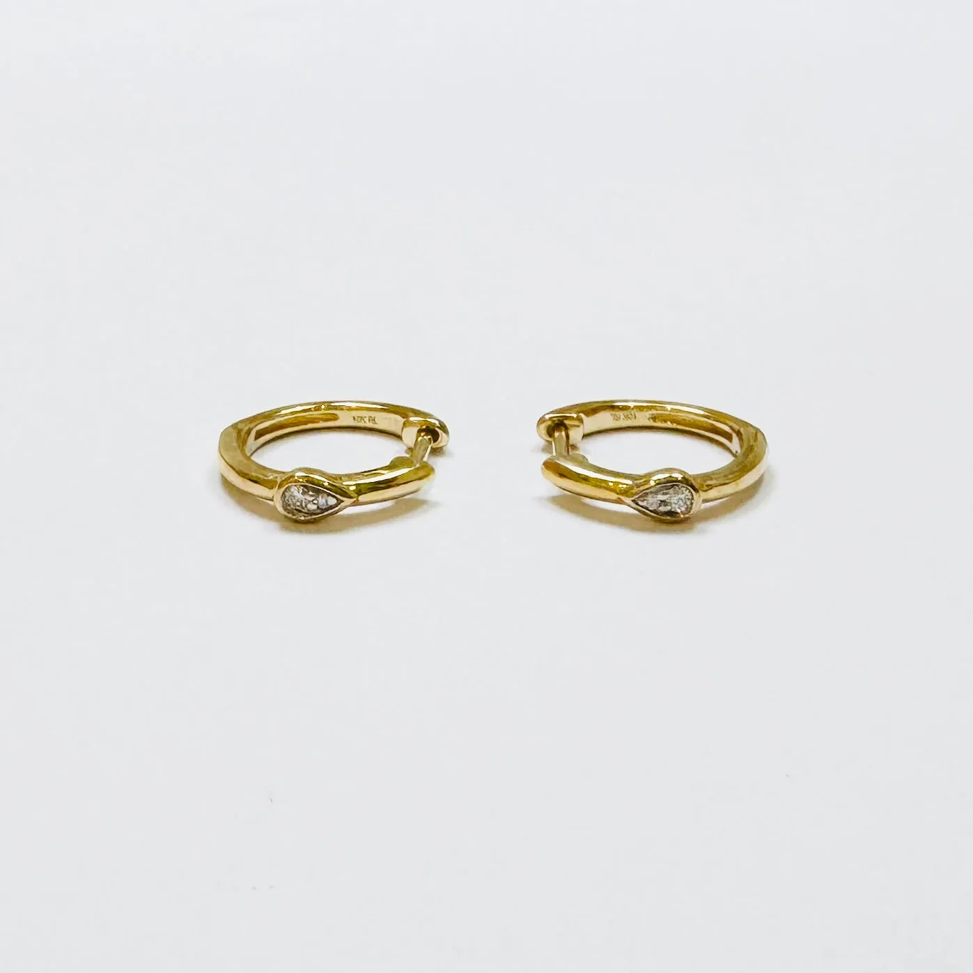 pear diamond huggies sold by Theodosia