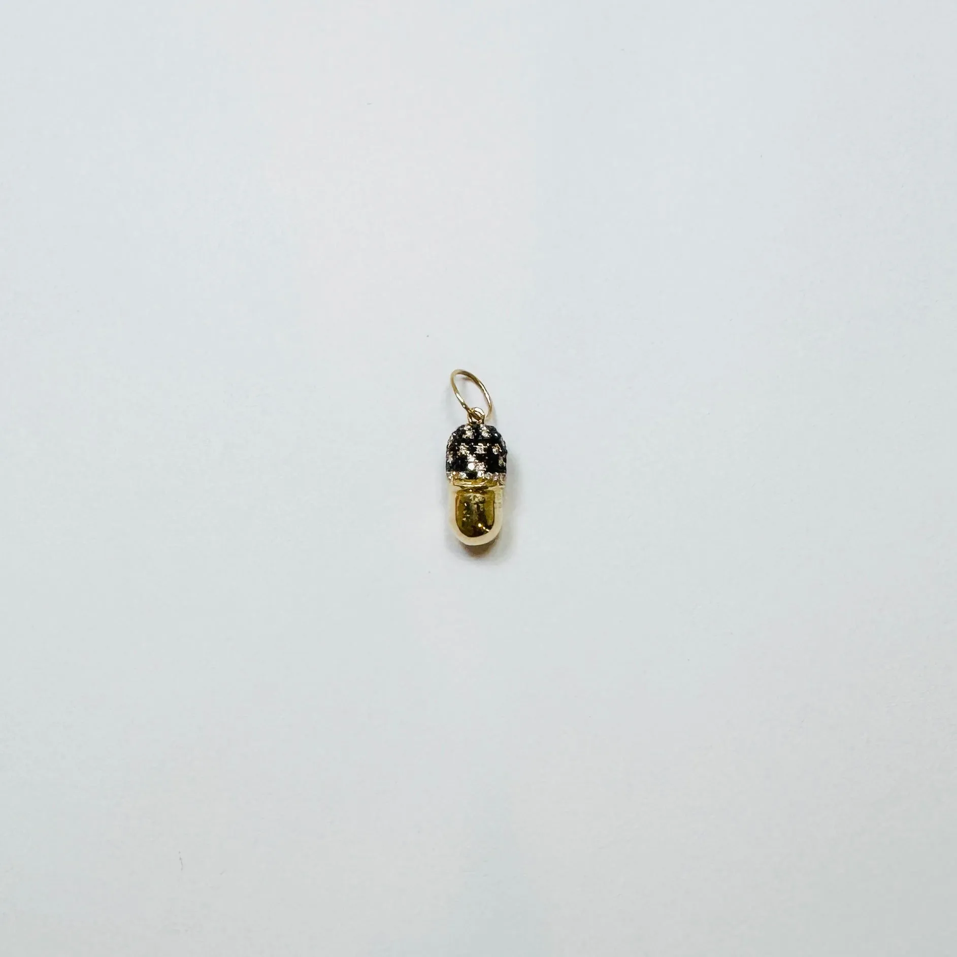 pill pendant sold by Theodosia