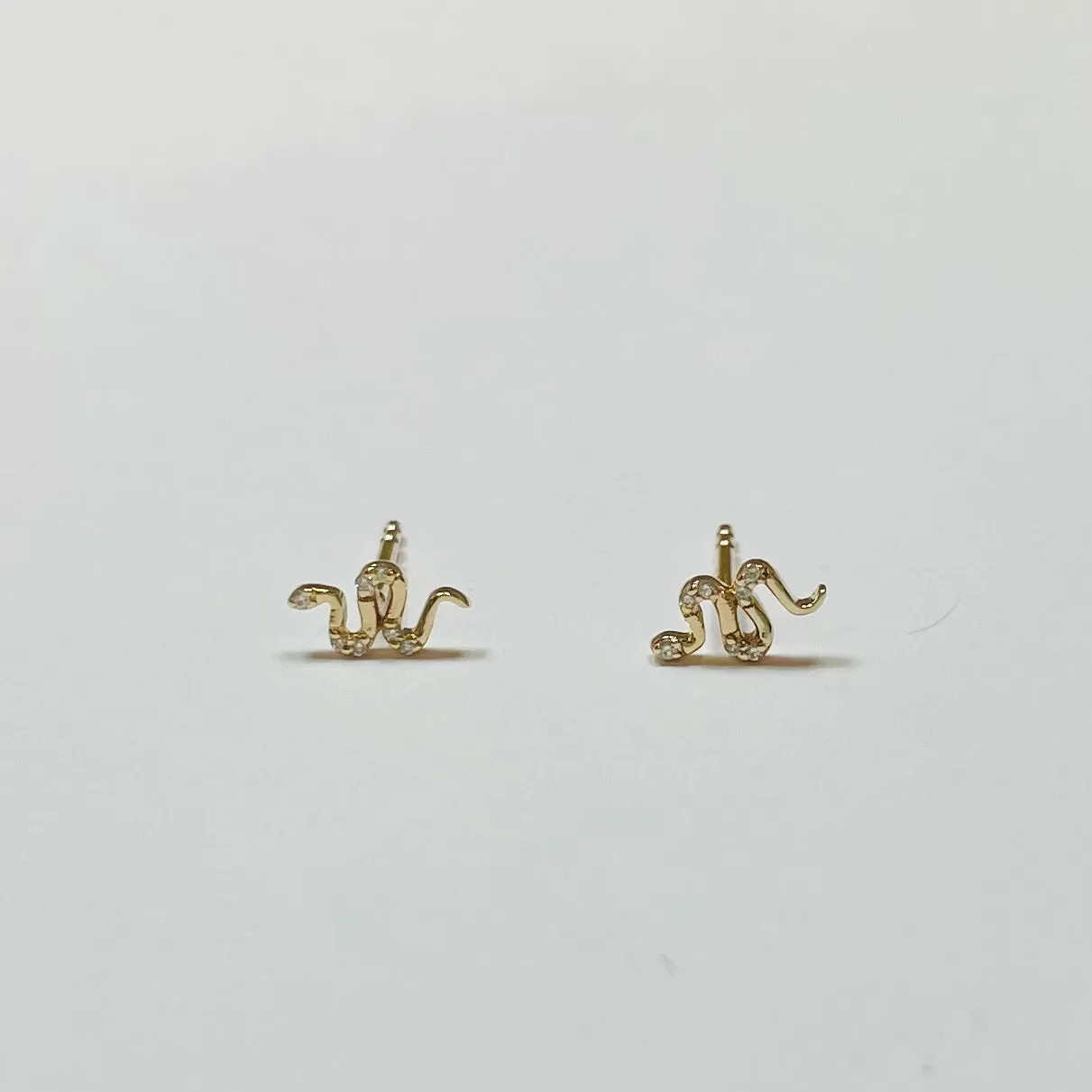 diamond snake studs sold by Theodosia