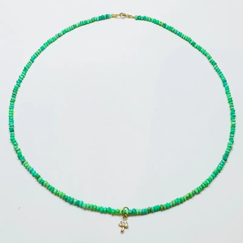 delicate neon turquoise necklace with mushroom charm sold by Theodosia