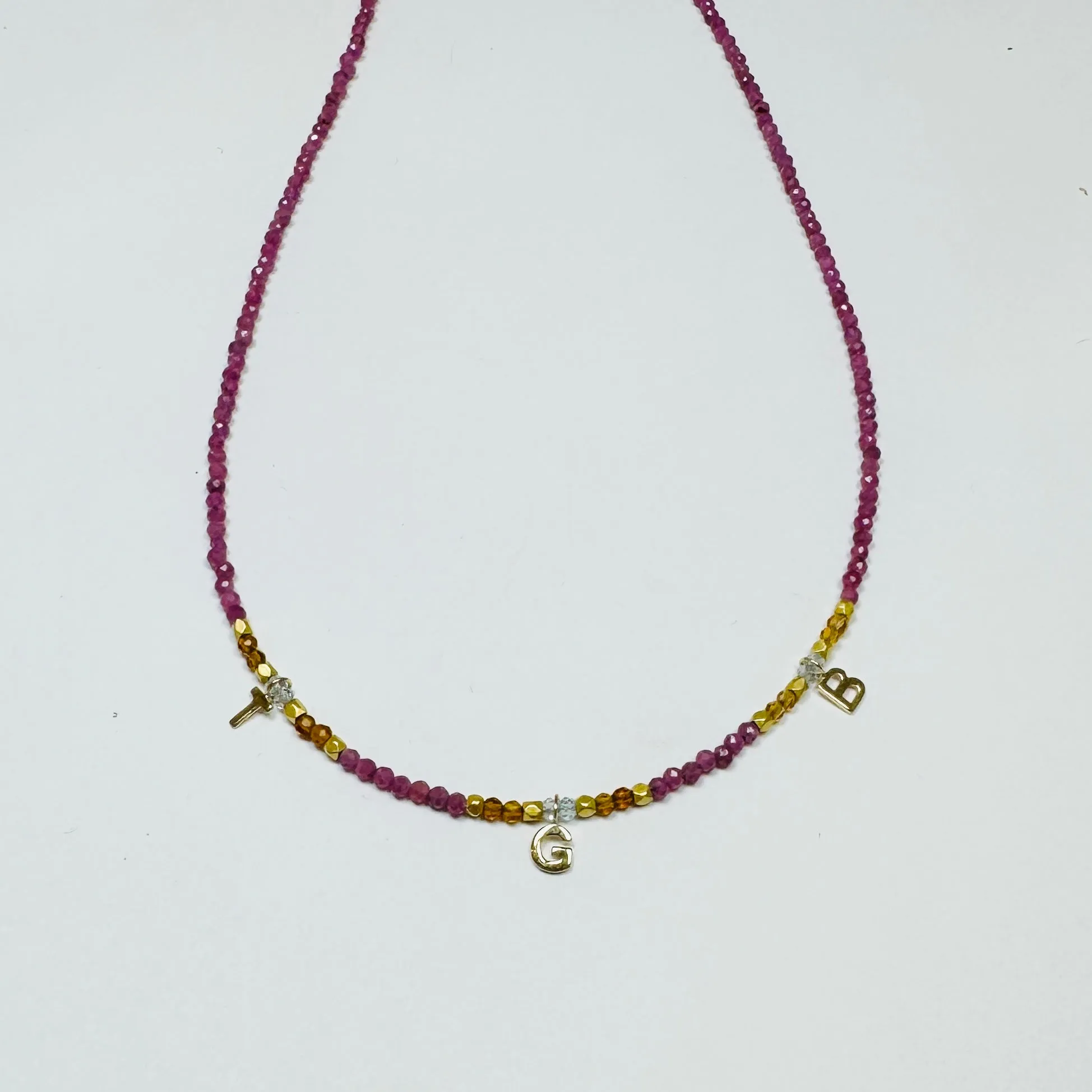 delicate inital necklace sold by Theodosia