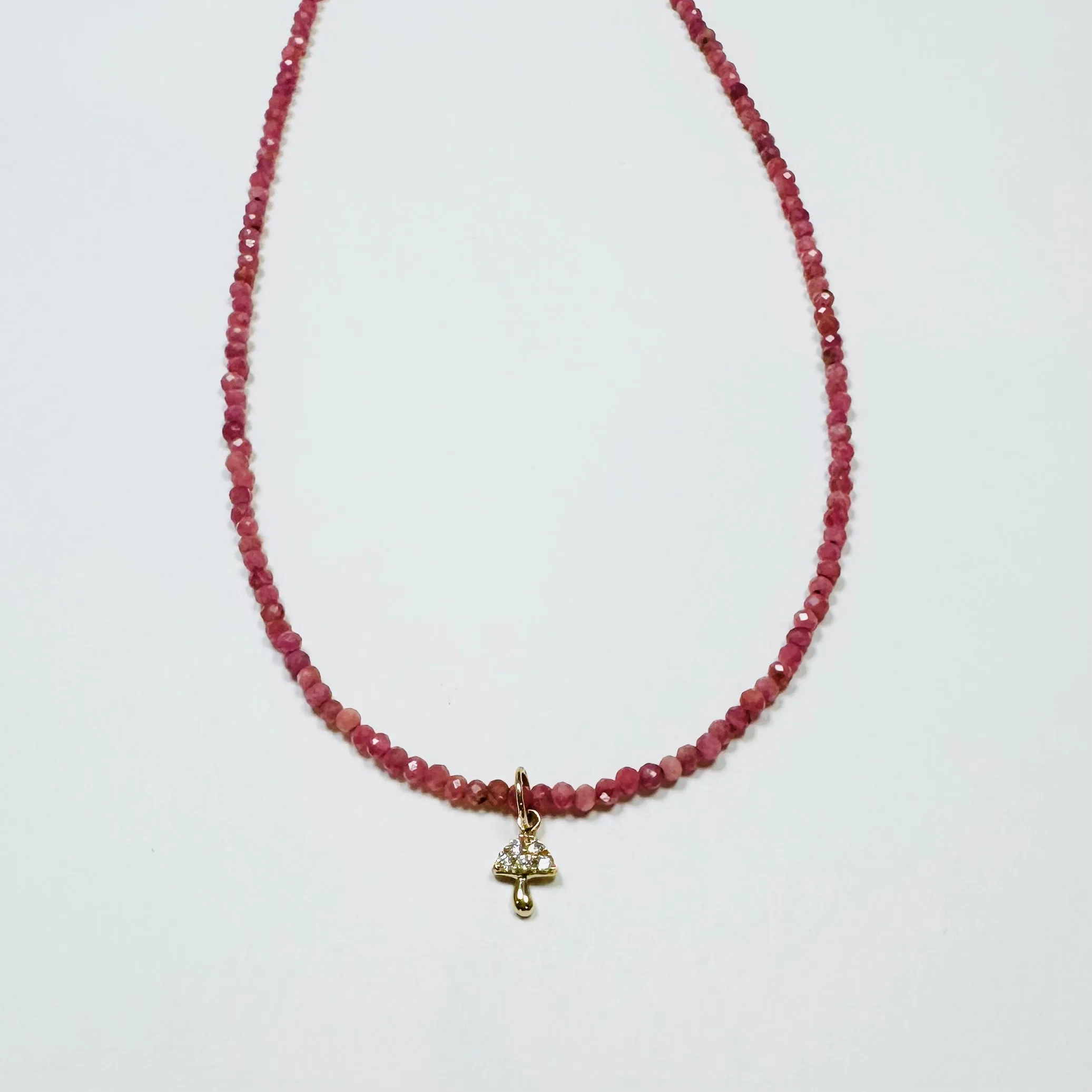 delicate mother of pearl necklace with mushroom charm sold by Theodosia