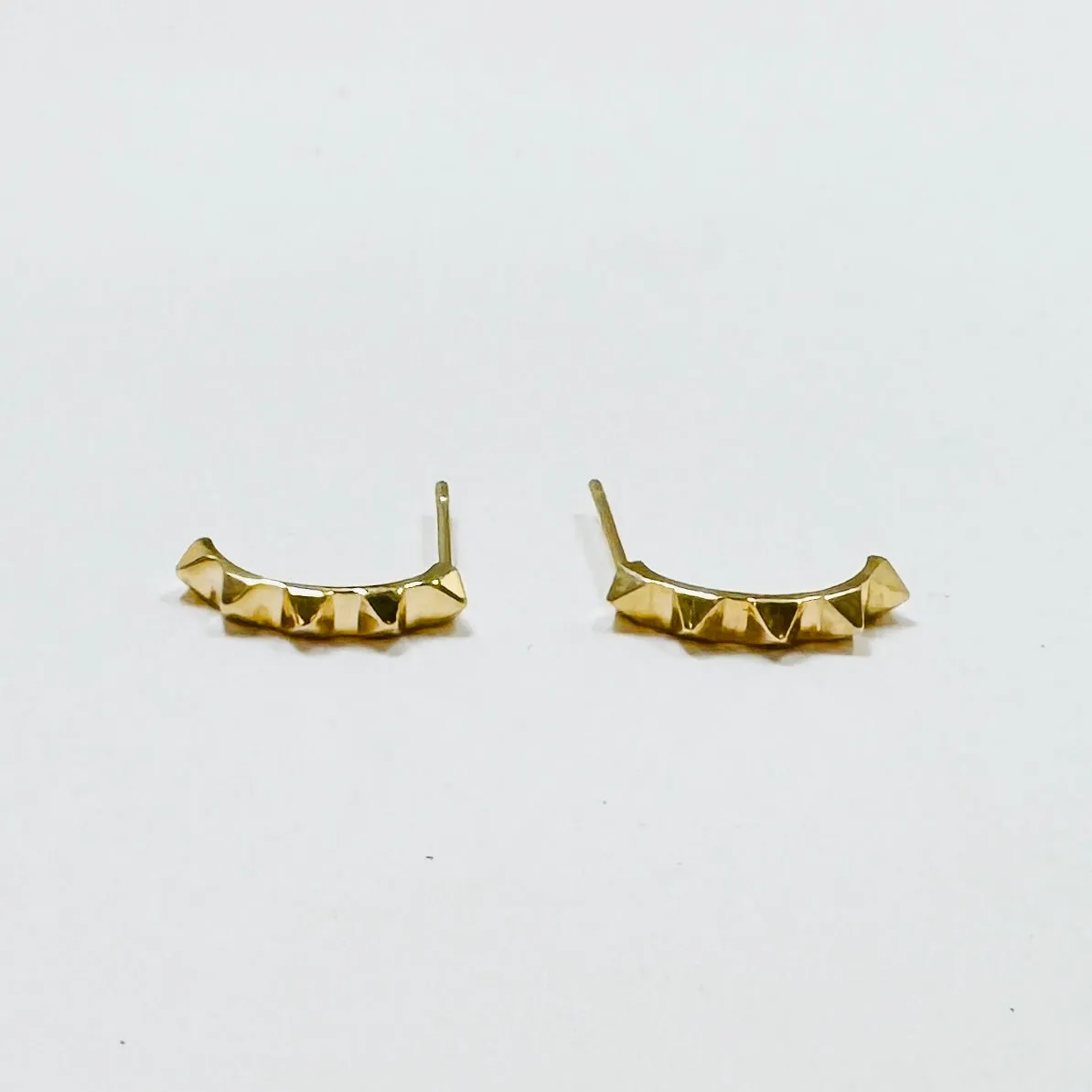 rock stud curved bars sold by Theodosia