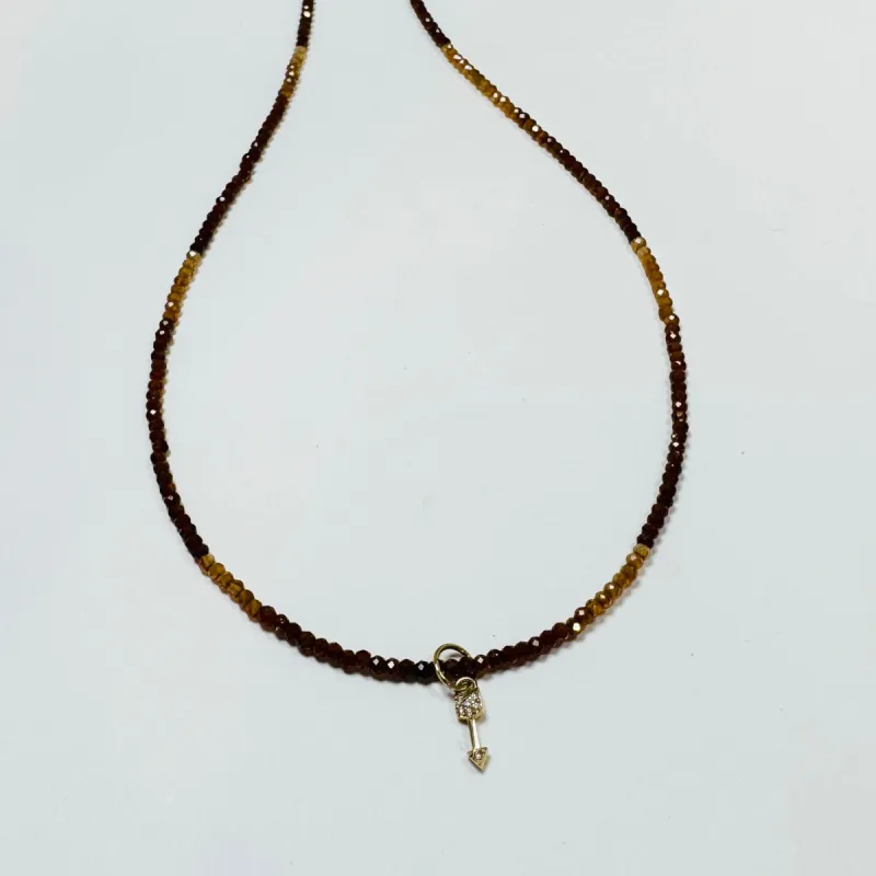 delicate hessonite necklace with arrow charm sold by Theodosia