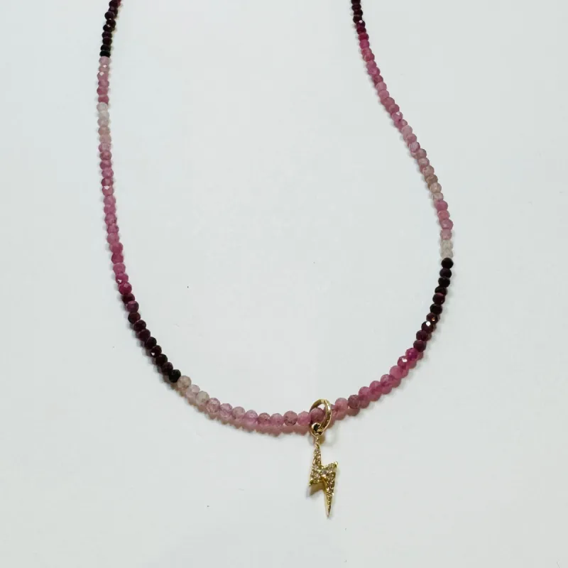 delicate shaded ruby necklace with lightning bolt charm sold by Theodosia