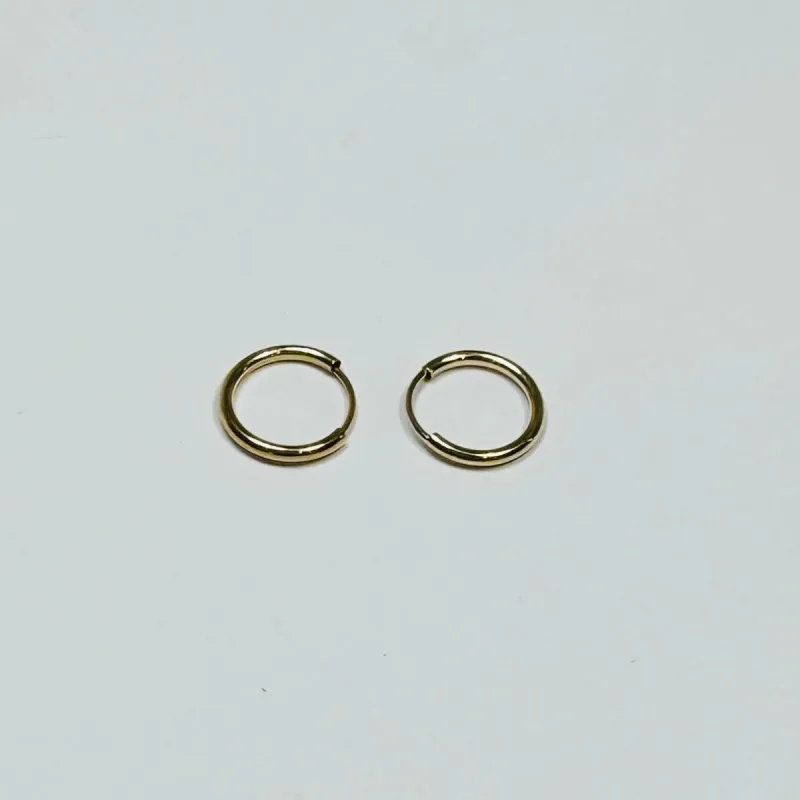 thin gold huggie sold by Theodosia