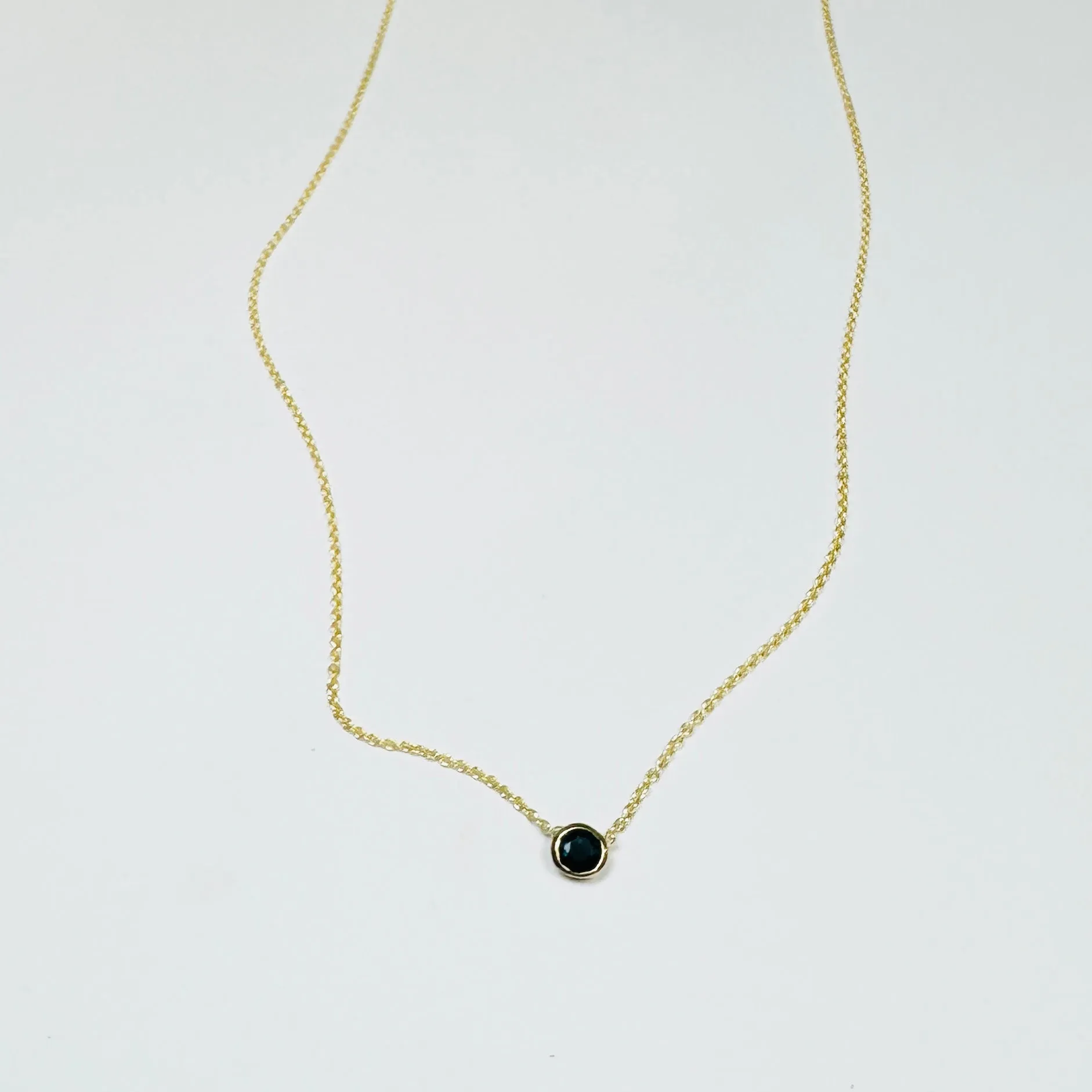 bezel set blue sapphire necklace sold by Theodosia