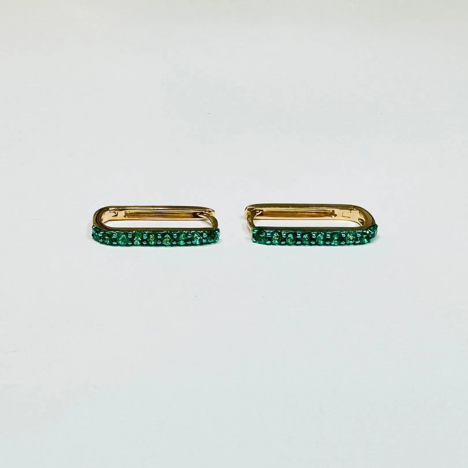 elongated emerald pave huggies sold by Theodosia