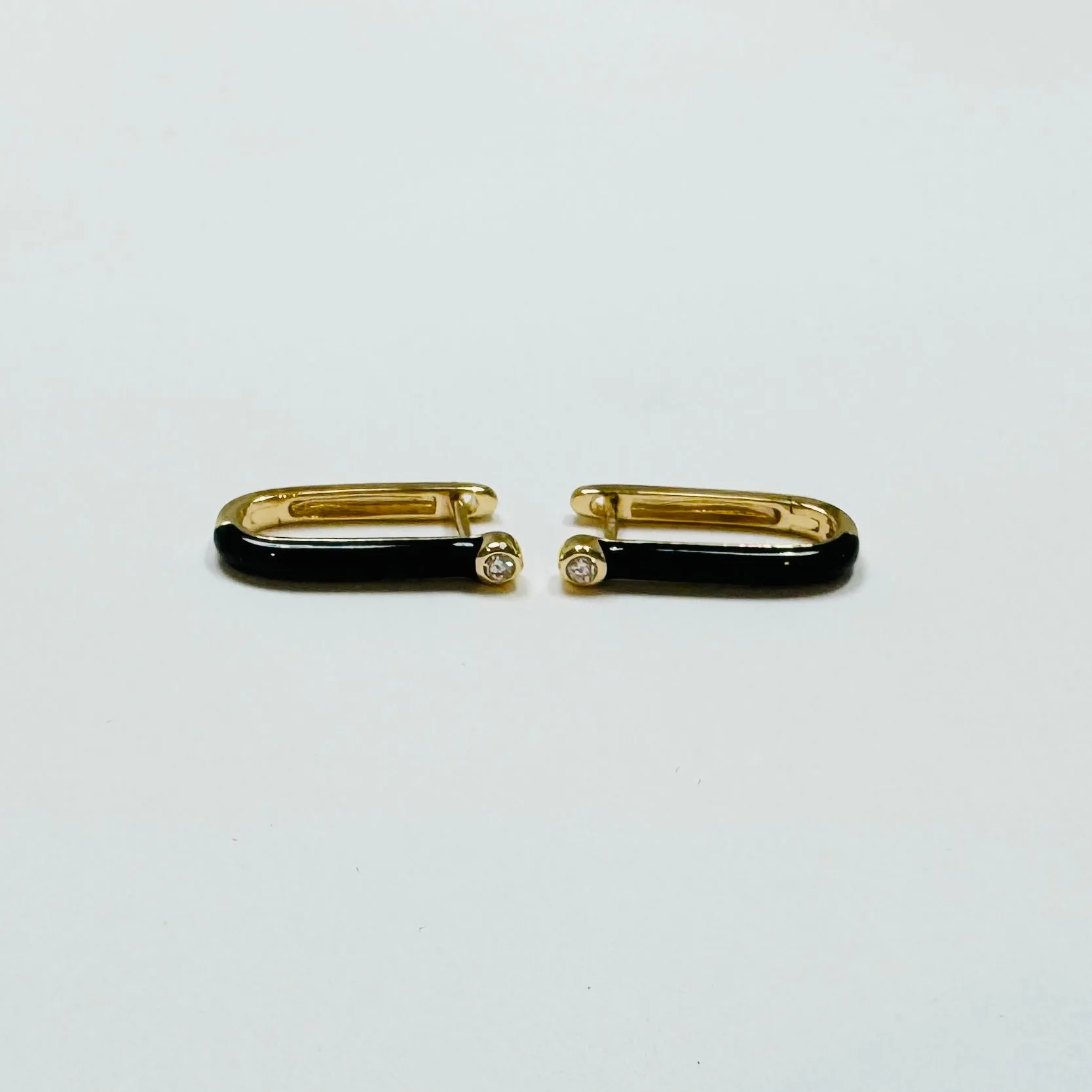 elongated enamel huggie sold by Theodosia