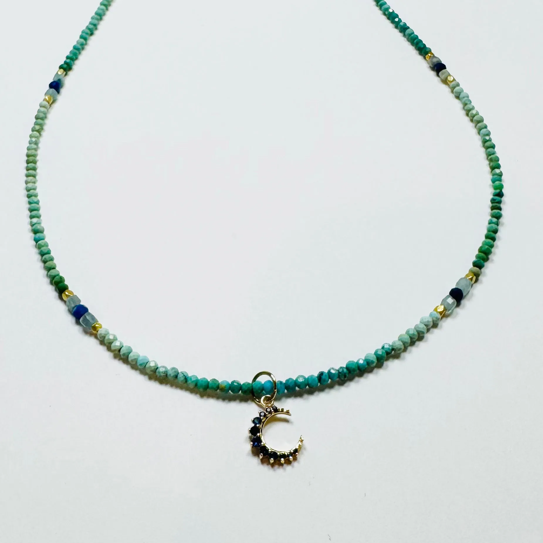 delicate sapphire moon necklace on fire opal sold by Theodosia