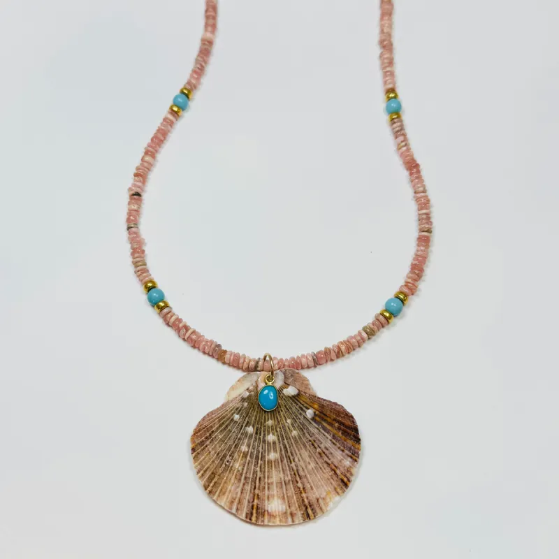 shaded blue sapphire necklace with shell pendant sold by Theodosia