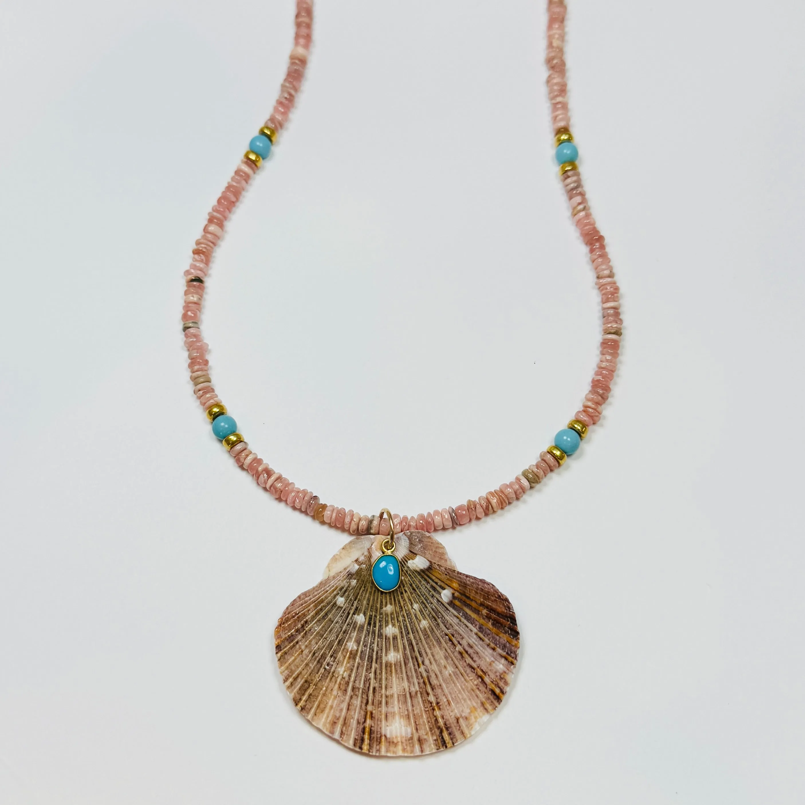 shaded blue sapphire necklace with shell pendant sold by Theodosia