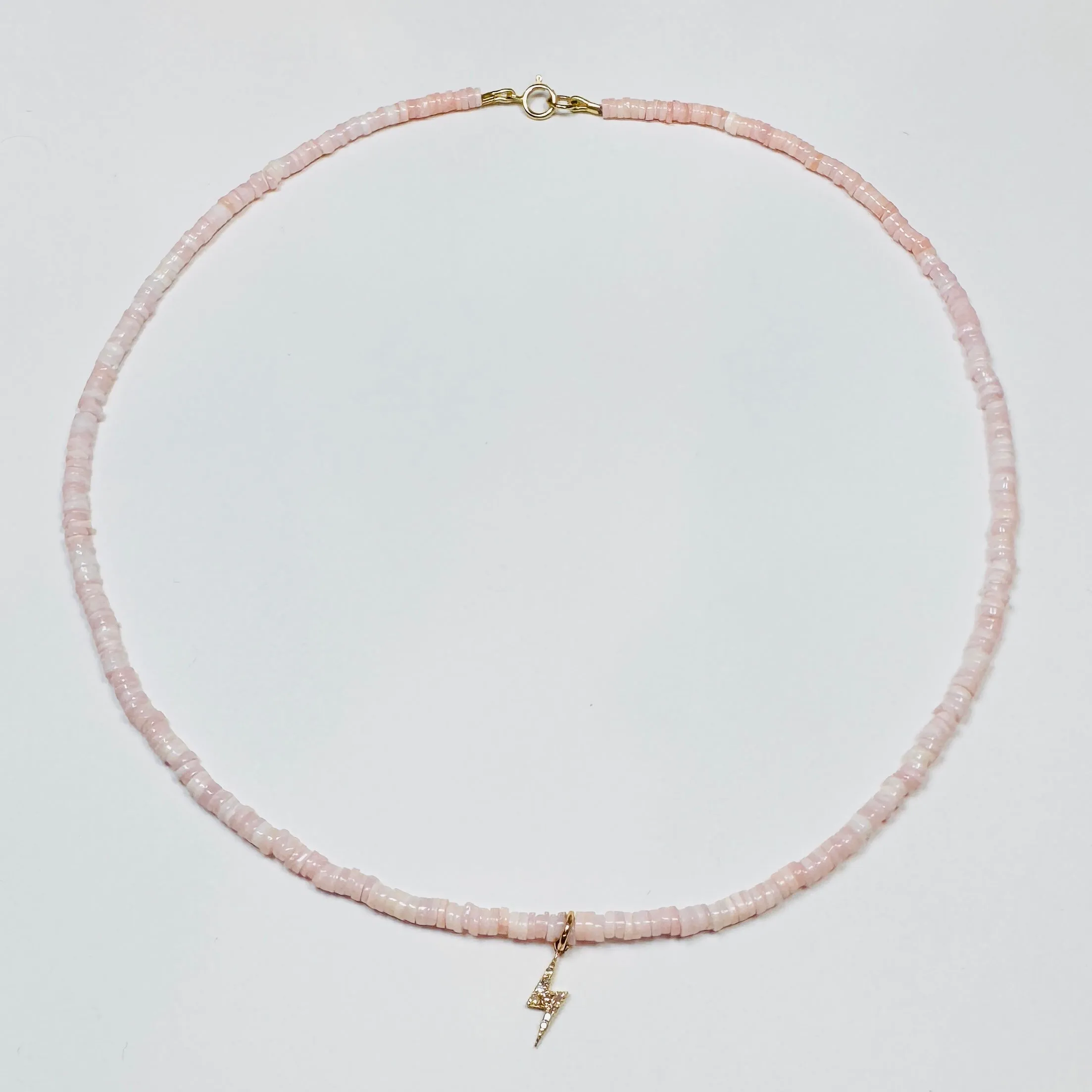 delicate gemstone necklace with lightning bolt charm sold by Theodosia