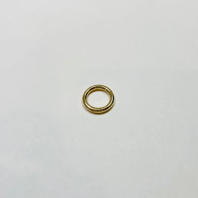 gold round connector sold by Theodosia