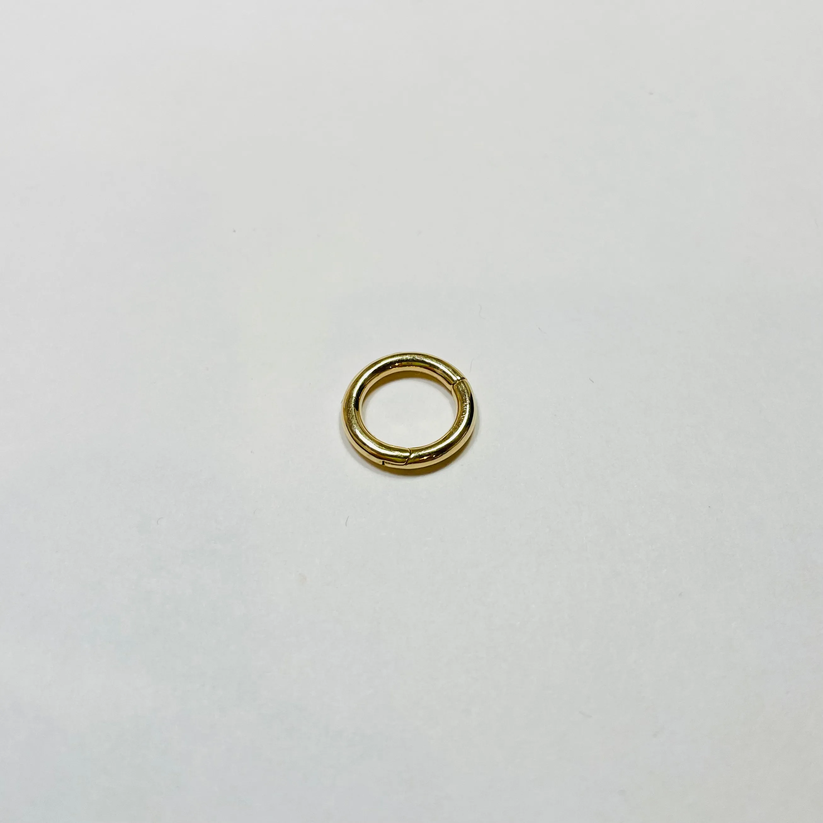 gold round connector sold by Theodosia
