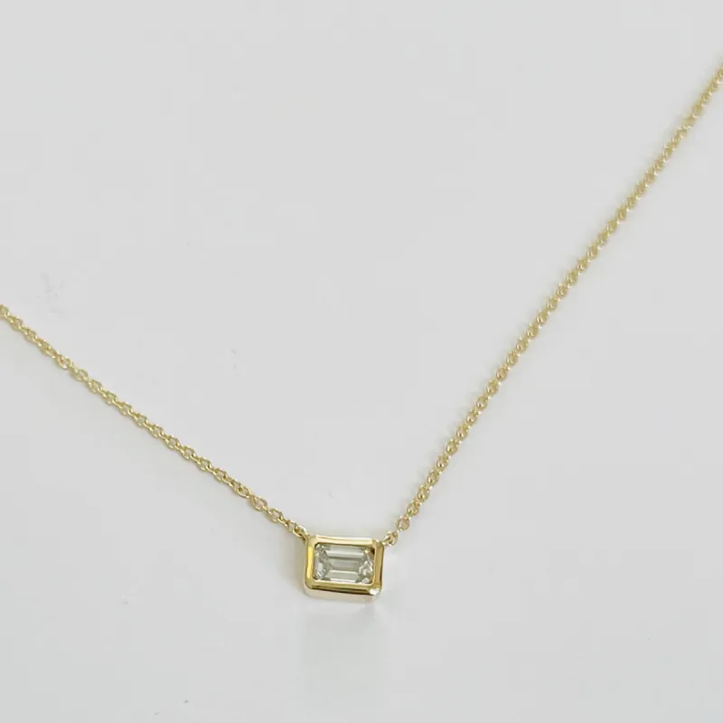 emerald cut diamond on gold chain sold by Theodosia