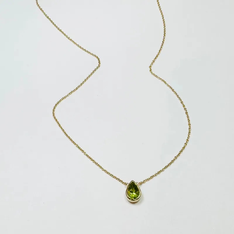 bezel set pear peridot necklace sold by Theodosia