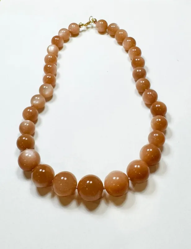 knotted gumball peach moonstone necklace sold by Theodosia