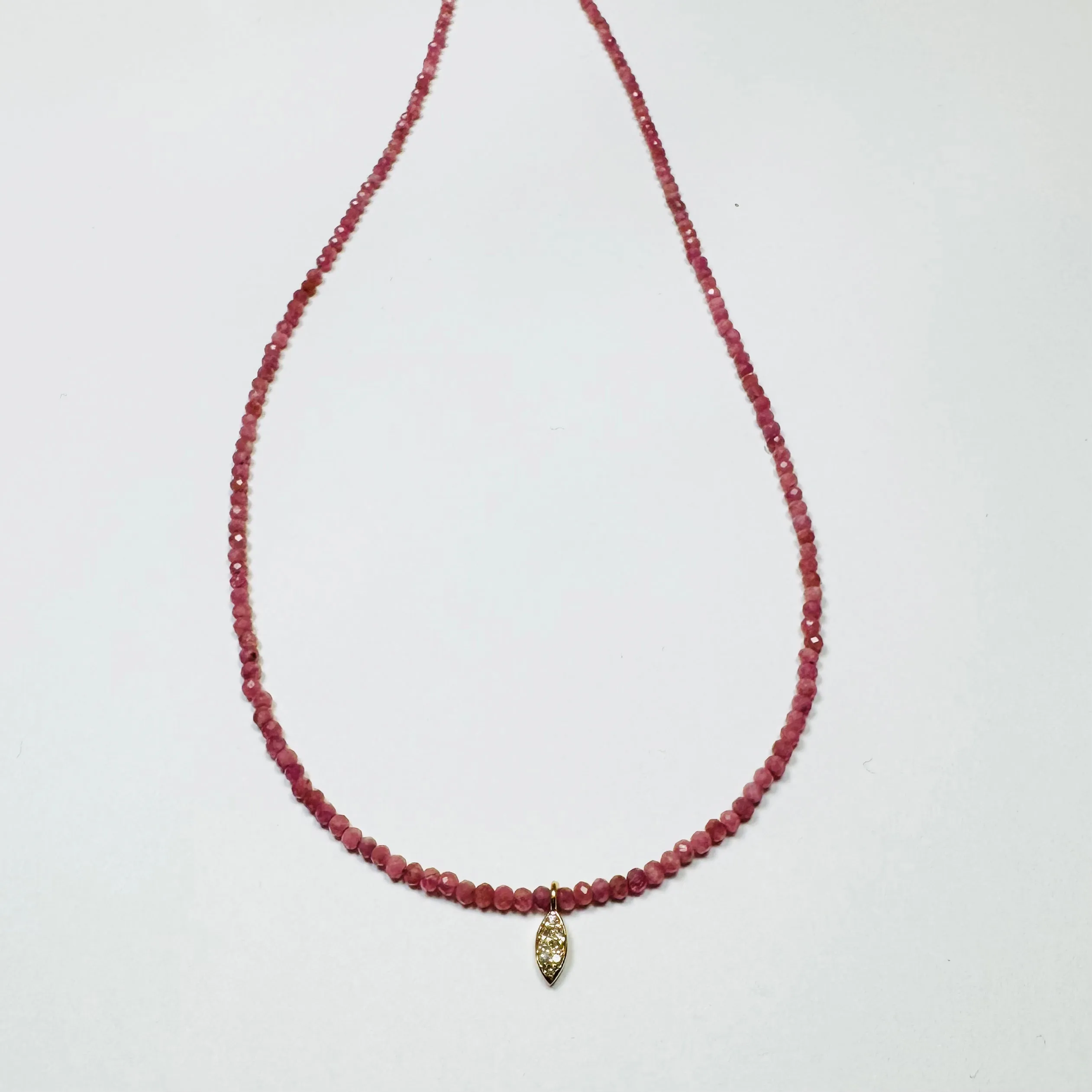 delicate pink sapphire necklace with diamond charm sold by Theodosia