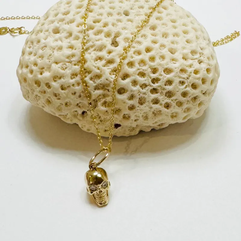 skull charm necklace sold by Theodosia