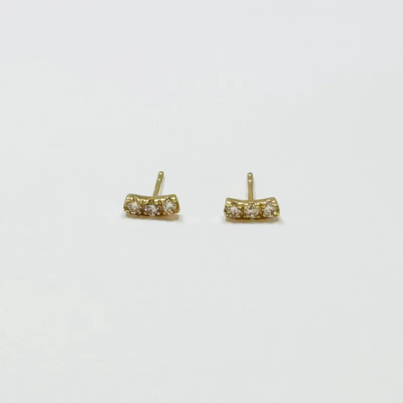 mini curved diamond bar studs sold by Theodosia
